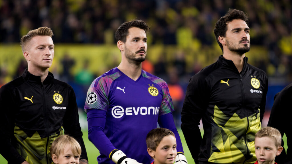Roman Burki (centre) and Marco Reus (left) (Photo by Peter Niedung/NurPhoto via Getty Images)